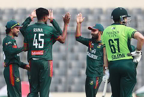 Bangladesh's Nahid Rana, centre, celebrates with teammates the wicket of Pakistan's Mohammad Rizwan during the first one day international cricket match between Bangladesh and Pakistan in Mirpur, Bangladesh.