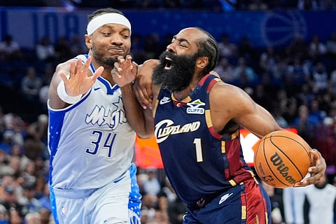 Cleveland Cavaliers guard James Harden (1) is fouled by Orlando Magic center Wendell Carter Jr. (34) as he drives to the basket during the second half of an NBA basketball game in Orlando, Fla.