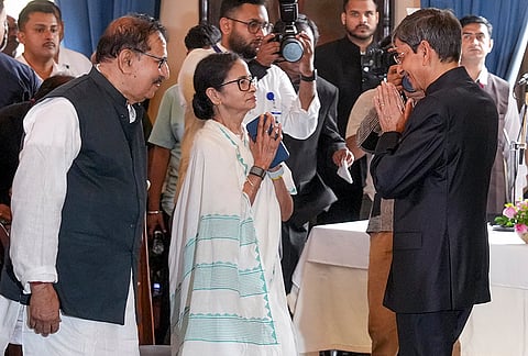 West Bengal Chief Minister Mamata Banerjee, centre, greets newly appointed Governor RN Ravi, right, during his swearing-in ceremony, at Lok Bhavan in Kolkata, West Bengal.