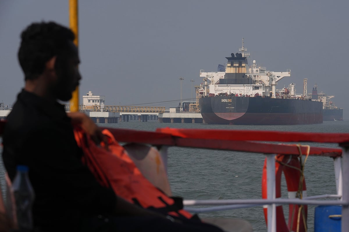 Liberia-flagged tanker Shenlong Suezmax, carrying crude oil from Saudi Arabia, that arrived clearing the Strait of Hormuz, is seen at the Mumbai Port in Mumbai, India, Thursday, March 12, 2026. (AP Photo/Rafiq Maqbool)
 - Rafiq Maqbool