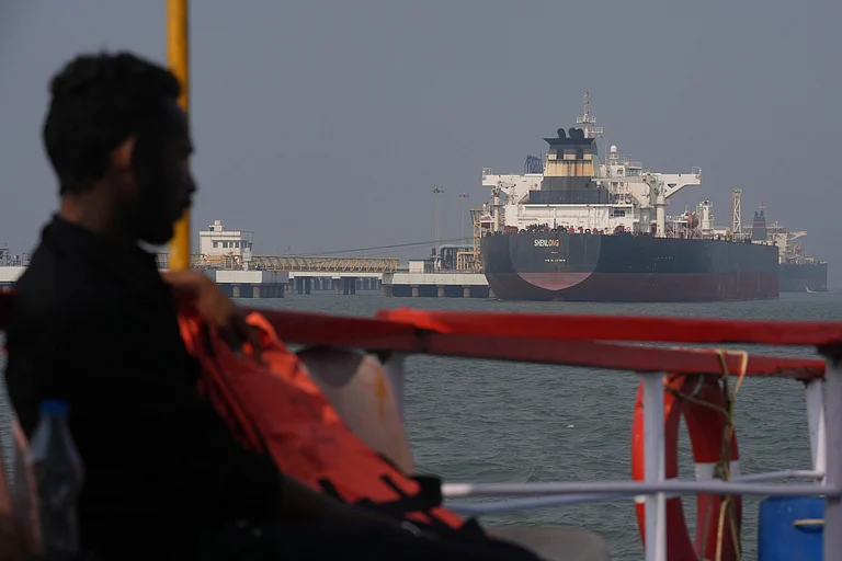 Liberia-flagged tanker Shenlong Suezmax, carrying crude oil from Saudi Arabia, that arrived clearing the Strait of Hormuz, is seen at the Mumbai Port in Mumbai, India, Thursday, March 12, 2026. (AP Photo/Rafiq Maqbool)
- Rafiq Maqbool