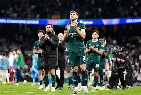 Manchester City' players walk off the pitch after a first leg round of 16 Champions League soccer match between Real Madrid and Manchester City in Madrid, Spain.