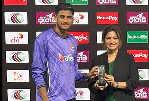 | Photo: AP/Mahmud Hossain Opu : Bangladesh's Nahid Rana, left, received player of the match award from director of the Bangladesh Cricket Board, Rubaba Dowla after Bangladesh won the first one day international cricket match against Pakistan in Mirpur, Bangladesh.