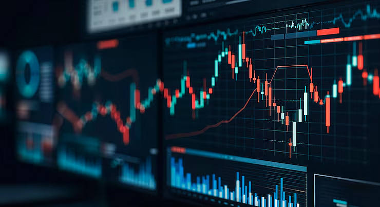 Cryptocurrency trading charts and candlestick graphs on digital market screens