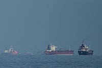Two Indian LPG Tankers Sail Through Strait Of Hormuz | Photo: AP/Altaf Qadri : Oil tankers and cargo ships line up in the Strait of Hormuz as seen from Khor Fakkan, United Arab Emirates.
