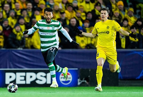 Sporting's Luis Suárez, left, and Bodo/Glimt's Jostein Gundersen fight for the ball during the Champions League soccer match between Bodo/Glimt and Sporting Lisbon, in Bodo, Norway.