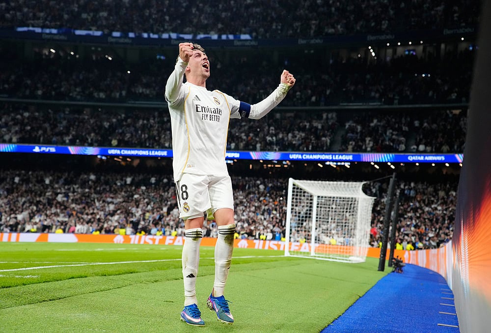 Real Madrid's Federico Valverde celebrates after scoring during a first leg round of 16 Champions League soccer match between Real Madrid and Manchester City in Madrid, Spain. - | Photo: AP/Jose Breton