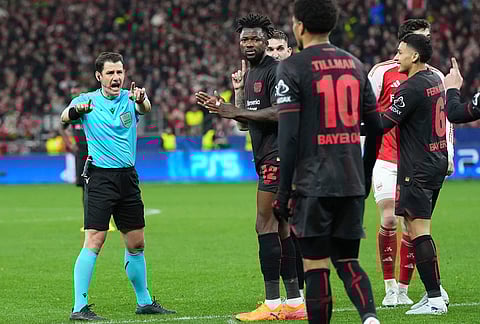 Turkish referee Umut Meler awards a penalty to Arsenal during the Champions League round of 16 first leg soccer match between Bayer Leverkusen and Arsenal FC in Leverkusen, Germany.
