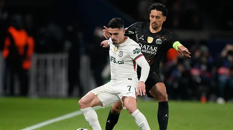 Chelsea's Pedro Neto, front, and PSG's Marquinhos challenge for the ball during the first leg of the Champions League round of 16. - AP/Michel Euler