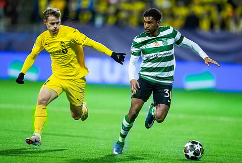Sporting's Luis Guilherme, right, and Bodo/Glimt's Ole Didrik Blomberg fight for the ball during the Champions League soccer match between Bodo/Glimt and Sporting Lisbon, in Bodo, Norway.