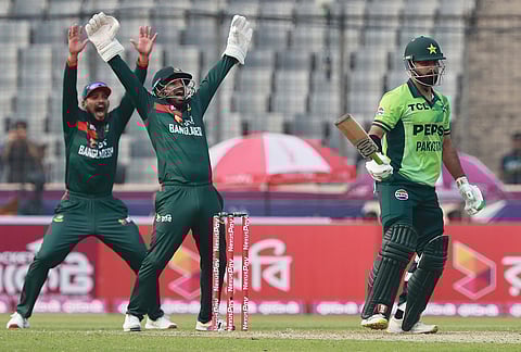 Bangladesh's Litton Das, centre, appeals successfully for the wicket of Pakistan's Hussain Talat during the first one day international cricket match between Bangladesh and Pakistan in Mirpur, Bangladesh.