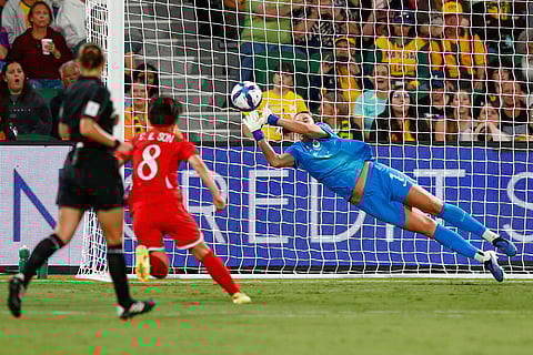 Australia's goalkeeper Mackenzie Arnold punches the ball clear of the goal during the Women's Asian Cup quarterfinal soccer match between Australia and North Korea in Perth, Australia.