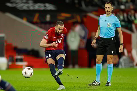 Lille's Nabil Bentaleb shoots during a first leg, round of 16 Europa League soccer match between Lille and Aston Villa in Lille, France.