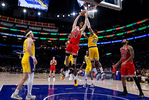 Los Angeles Lakers forward Maxi Kleber (14) goes to the basket against the Los Angeles Lakers during the second half of an NBA basketball game, in Los Angeles. 