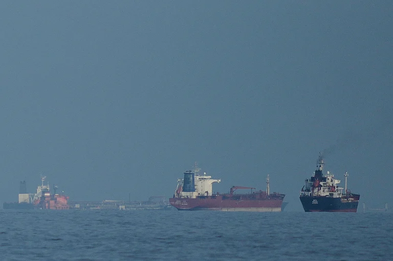 Oil tankers and cargo ships line up in the Strait of Hormuz as seen from Khor Fakkan, United Arab Emirates, Wednesday, March 11, 2026 - Credit: AP Photo/ Altaf Qadri | Representative Image