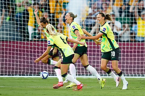 Australia's Alanna Kennedy, centre, celebrates with teammates after scoring her team's first goal during the Women's Asian Cup quarterfinal soccer match between Australia and North Korea in Perth, Australia.