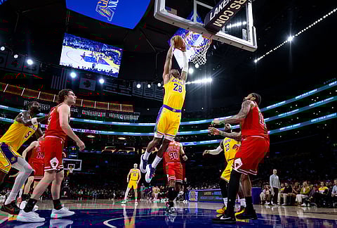 Los Angeles Lakers forward Rui Hachimura (28) dunks the ball during the first half of an NBA basketball game against the Chicago Bulls, in Los Angeles.