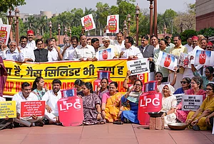 | Photo: PTI/Ravi Choudhary : LoP in the Lok Sabha Rahul Gandhi, with Congress MPs TR Baalu, KC Venugopal, Jothimani, Praniti Shinde and others stage a protest in Parliament premises over 'LPG shortage' during the second part of Budget session, in New Delhi.