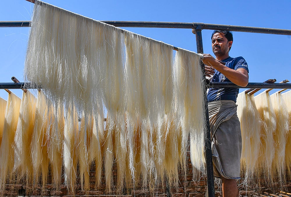 A worker prepares vermicelli on the last friday during the holy month of Ramzan