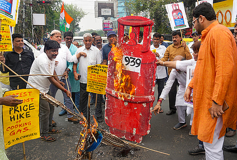 Activists of the South Kolkata District Congress Committee stage a protest against the recent hike in domestic and commercial LPG cylinder prices announced by the central government, at Hazra More, in Kolkata.