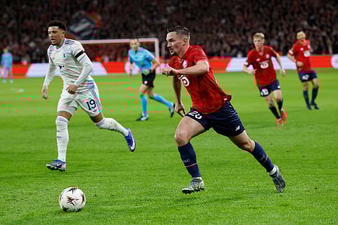 Lille's Noah Edjouma in action in front of Aston Villa's Jadon Sancho during a first leg, round of 16 Europa League soccer match between Lille and Aston Villa in Lille, France.