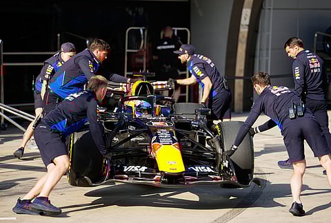 Red Bull driver Max Verstappen of the Netherlands is pushed back into his garage during the sprint qualifying ahead of the Chinese Formula One Grand Prix, in Shanghai, China.