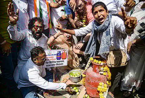 Congress members stage a protest over an ongoing LPG crisis in the country, in Nagpur, Maharashtra.