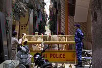 SURESH K PANDEY : Police and CRPF personnel manning the barricades surrounding the houses of Tarun Kumar and the accused.