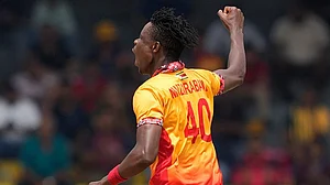 | Photo: AP/Eranga Jayawardena : Zimbabwe's Blessing Muzarabani celebrates the wicket of Australia's Tim David during the T20 World Cup cricket match between Australia and Zimbabwe in Colombo, Sri Lanka.
