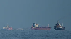 Credit: AP Photo/ Altaf Qadri | Representative Image : Oil tankers and cargo ships line up in the Strait of Hormuz as seen from Khor Fakkan, United Arab Emirates, Wednesday, March 11, 2026