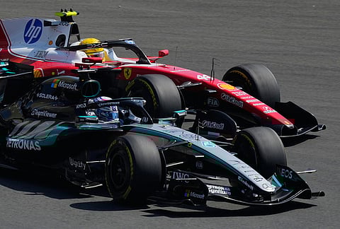 Mercedes driver George Russell, left, of Britain against Ferrari driver Lewis Hamilton of Britain during the Sprint Race of the Chinese Formula One Grand Prix at the Shanghai International Circuit, in Shanghai, China.