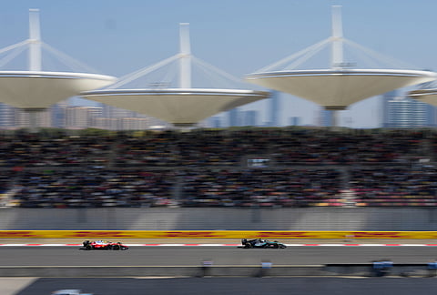 Mercedes driver George Russell, right, of Britain leads Ferrari driver Lewis Hamilton of Britain during the Sprint Race of the Chinese Formula One Grand Prix at the Shanghai International Circuit, in Shanghai, China.