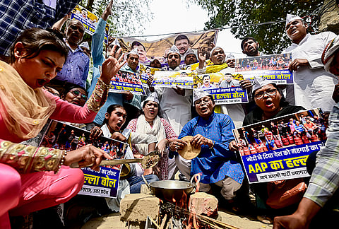 Aam Aadmi Party (AAP) workers stage a protest amid the ongoing LPG crisis, in Prayagraj, Uttar Pradesh.