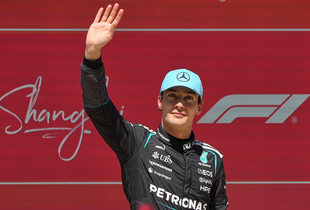 Winner Mercedes driver George Russell of Britain waves after the Sprint Race of the Chinese Formula One Grand Prix at the Shanghai International Circuit, in Shanghai, China. - | Photo: AP/Andy Wong