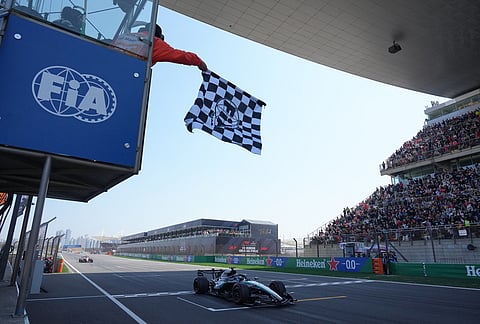Mercedes driver George Russell of Britain crosses the finish line and wins the Sprint Race of the Chinese Formula One Grand Prix at the Shanghai International Circuit, in Shanghai, China.