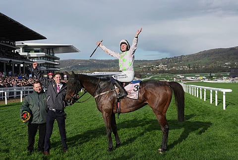 Paul Townend jockey of Gaelic Warrior the winner of the Gold Cup race, celebrates following the race on day four of the 2026 Cheltenham Festival in Cheltenham, England.