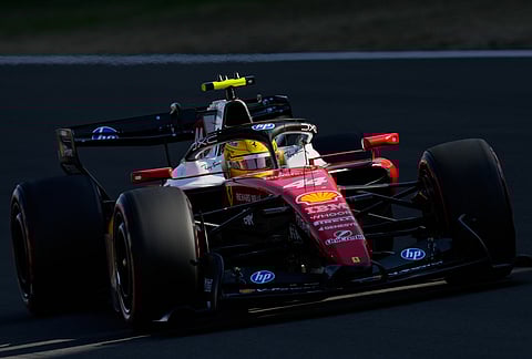 Ferrari driver Lewis Hamilton of Britain steers his car during the qualifying session of the Chinese Formula One Grand Prix at the Shanghai International Circuit, in Shanghai, China.