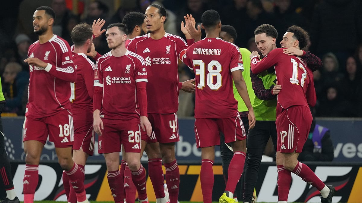 Liverpool's Curtis Jones, right, celebrates with teammates after scoring during the English FA Cup soccer match between Wolves and Liverpool in Wolverhampton, England, Friday, March 6, 2026. - | Photo: AP/Dave Shopland