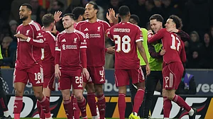 | Photo: AP/Dave Shopland : Liverpool's Curtis Jones, right, celebrates with teammates after scoring during the English FA Cup soccer match between Wolves and Liverpool in Wolverhampton, England, Friday, March 6, 2026.