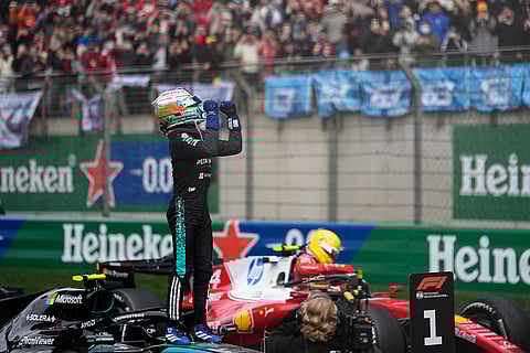 Mercedes driver Andrea Kimi Antonelli of Italy celebrates after he clocked the fastest time in the Chinese Formula One Grand Prix race at the Shanghai International Circuit, in Shanghai, China.