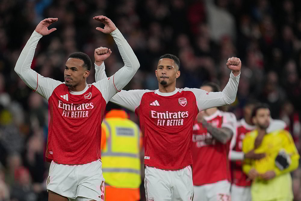 Arsenal's Gabriel, left, and William Saliba celebrate after the English Premier League soccer match between Arsenal and Everton in London, England. - | Photo: AP/Kin Cheung