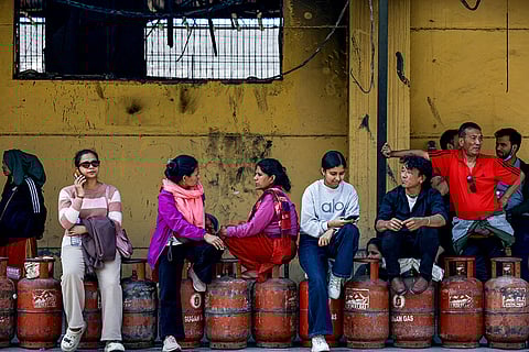 People wait in a queue with LPG cylinders to brace for possible fuel shortages in the wake of the ongoing West Asia conflict, in Kathmandu, Nepal.