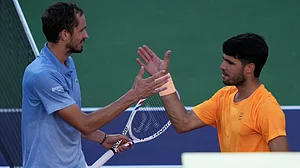 AP/Mark J. Terrill : Daniil Medvedev, of Russia, left, is congratulated by Carlos Alcaraz, of Spain, after Medvedev defeated Alcaraz during a semifinal match at the BNP Paribas Open tennis tournament.