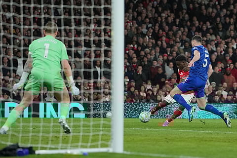 Arsenal's Bukayo Saka shoots during the English Premier League soccer match between Arsenal and Everton in London, England.