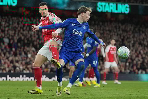 Arsenal's Gabriel Martinelli, left, and Everton's Jake O'Brien fight for the ball during the English Premier League soccer match between Arsenal and Everton in London, England.
