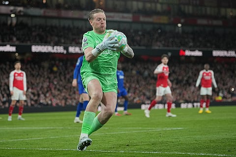 Everton's goalkeeper Jordan Pickford catches the ball during the English Premier League soccer match between Arsenal and Everton in London, England.