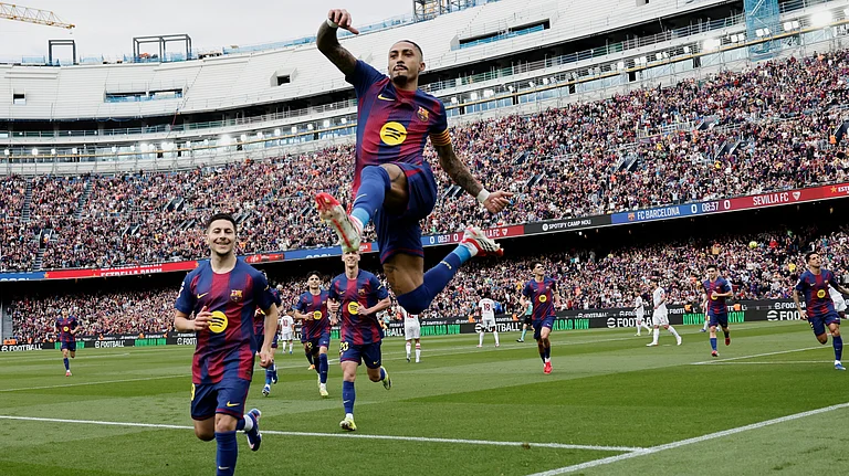 Barcelona's Raphinha celebrates after scoring his side's opening goal during the Spanish La Liga soccer match between Barcelona and Sevilla in Barcelona, Spain, Sunday, March 15, 2026. - | Photo: AP/Joan Monfort