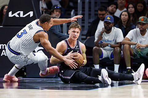 Orlando Magic guard Desmond Bane (3) defends Miami Heat guard Pelle Larsson, right, during the first half of an NBA basketball game in Miami.