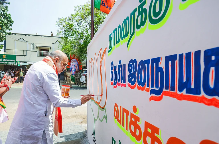 Union Home Minister Amit Shah participates in a wall-writing campaign in Puducherry Puducherry, Feb 14 (ANI): Union Home Minister Amit Shah participates in a wall-writing campaign ahead of the forthcoming Puducherry Legislative Assembly elections, in Puducherry on Saturday. (@AmitShah X ANI Photo) Puducherry Tamil Nadu India - ANI