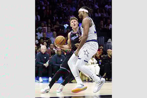 Orlando Magic center Wendell Carter Jr., right, defends Miami Heat guard Pelle Larsson,left, during the second half of an NBA basketball game in Miami.